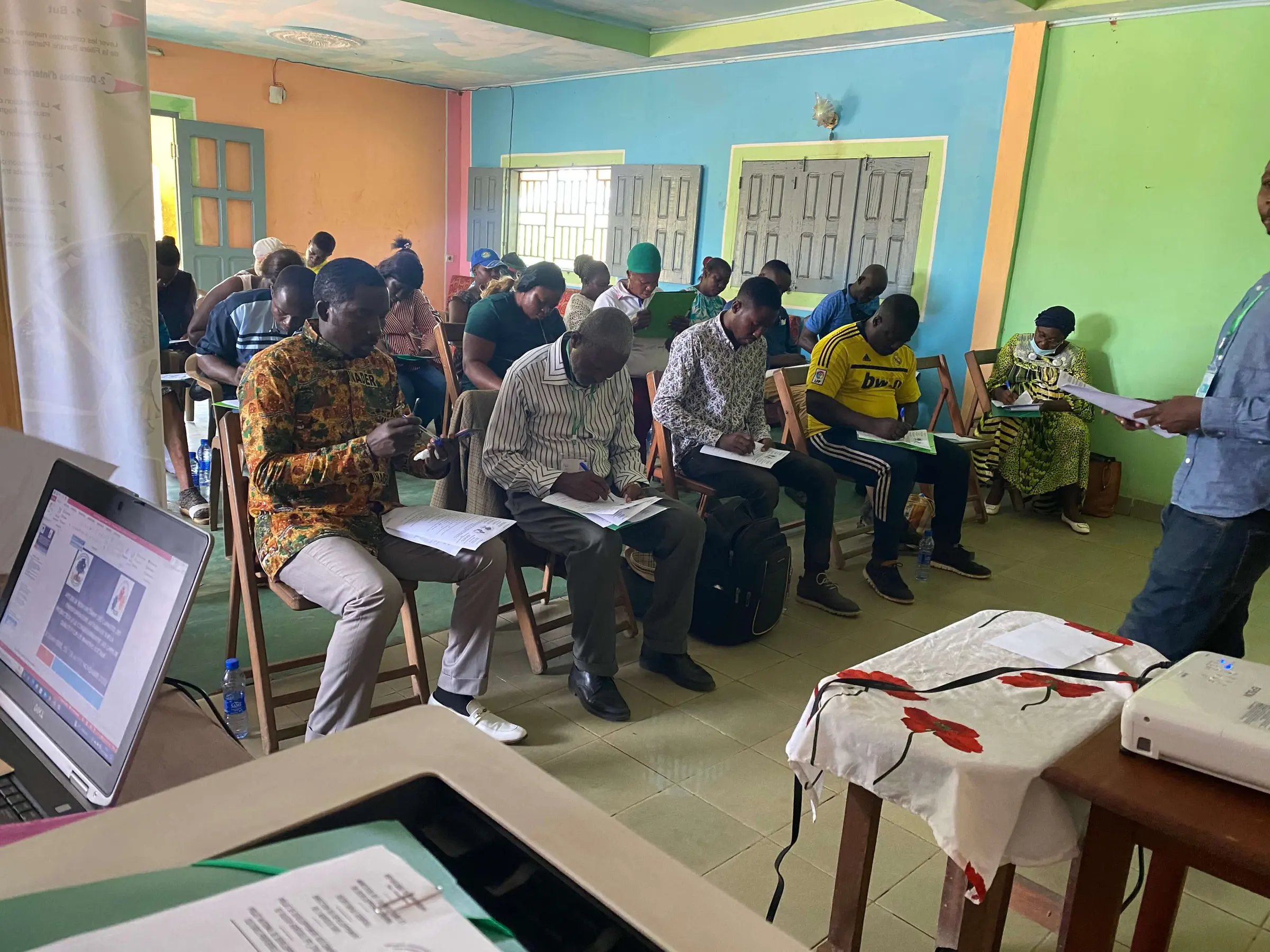 Participants seated in rows at a Mumita training session in a meeting hall