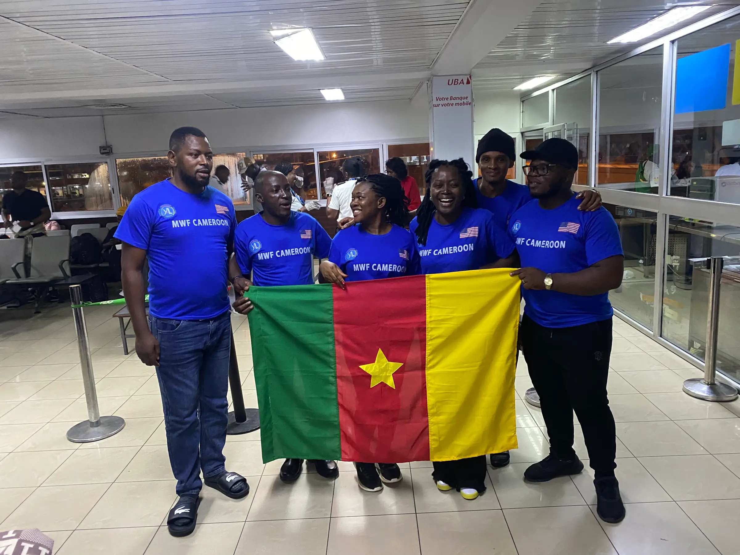 A group of Mandela Washington Fellows from Cameroon with the national flag
