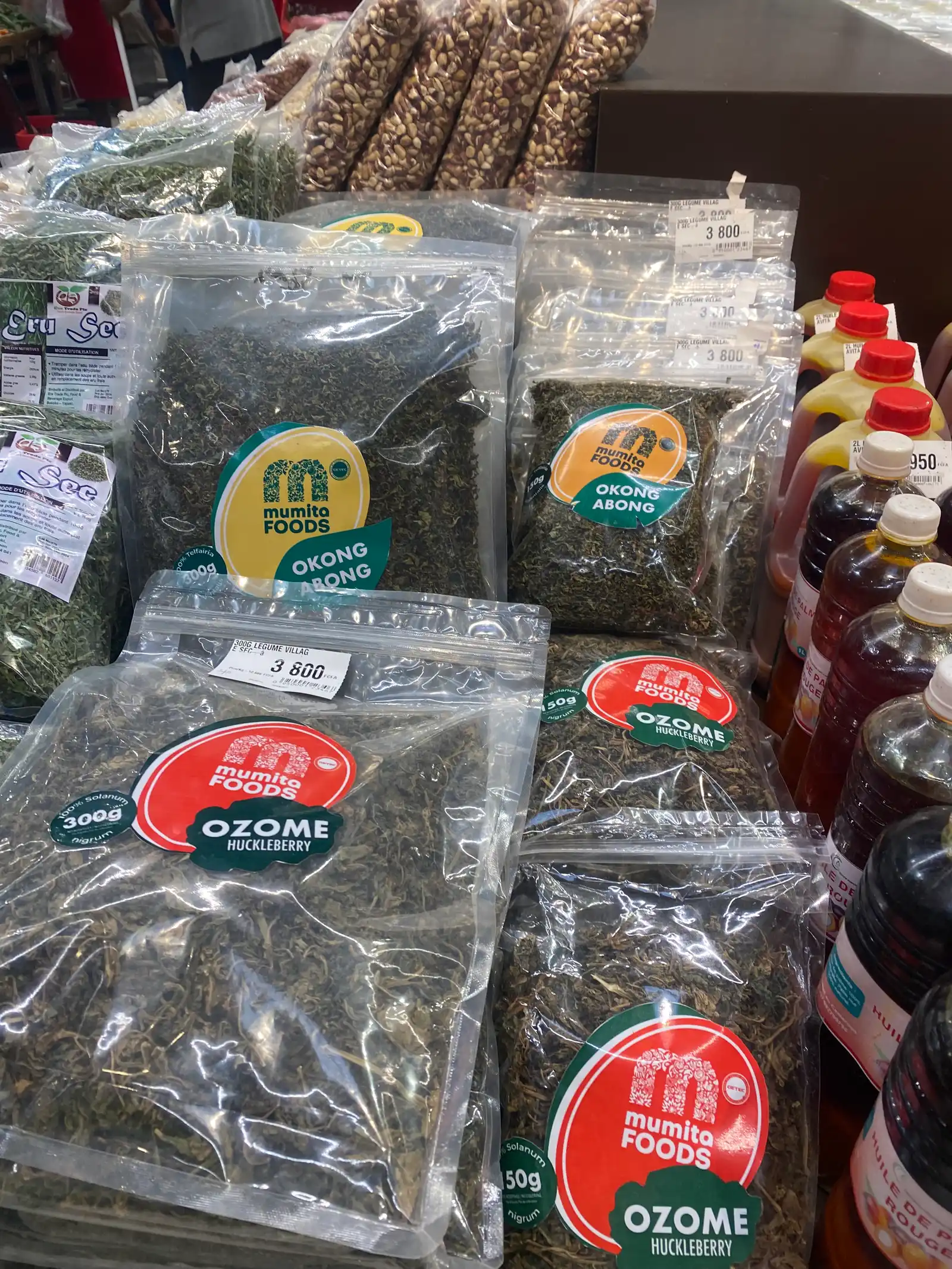 Mumita Foods okong and ozome packs on a supermarket display beside bottled oils